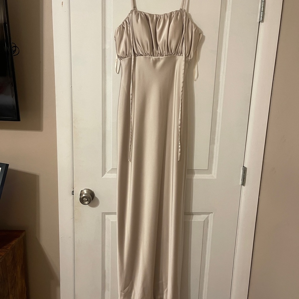 REVELRY satin bridesmaids dress in “soft champagne”.